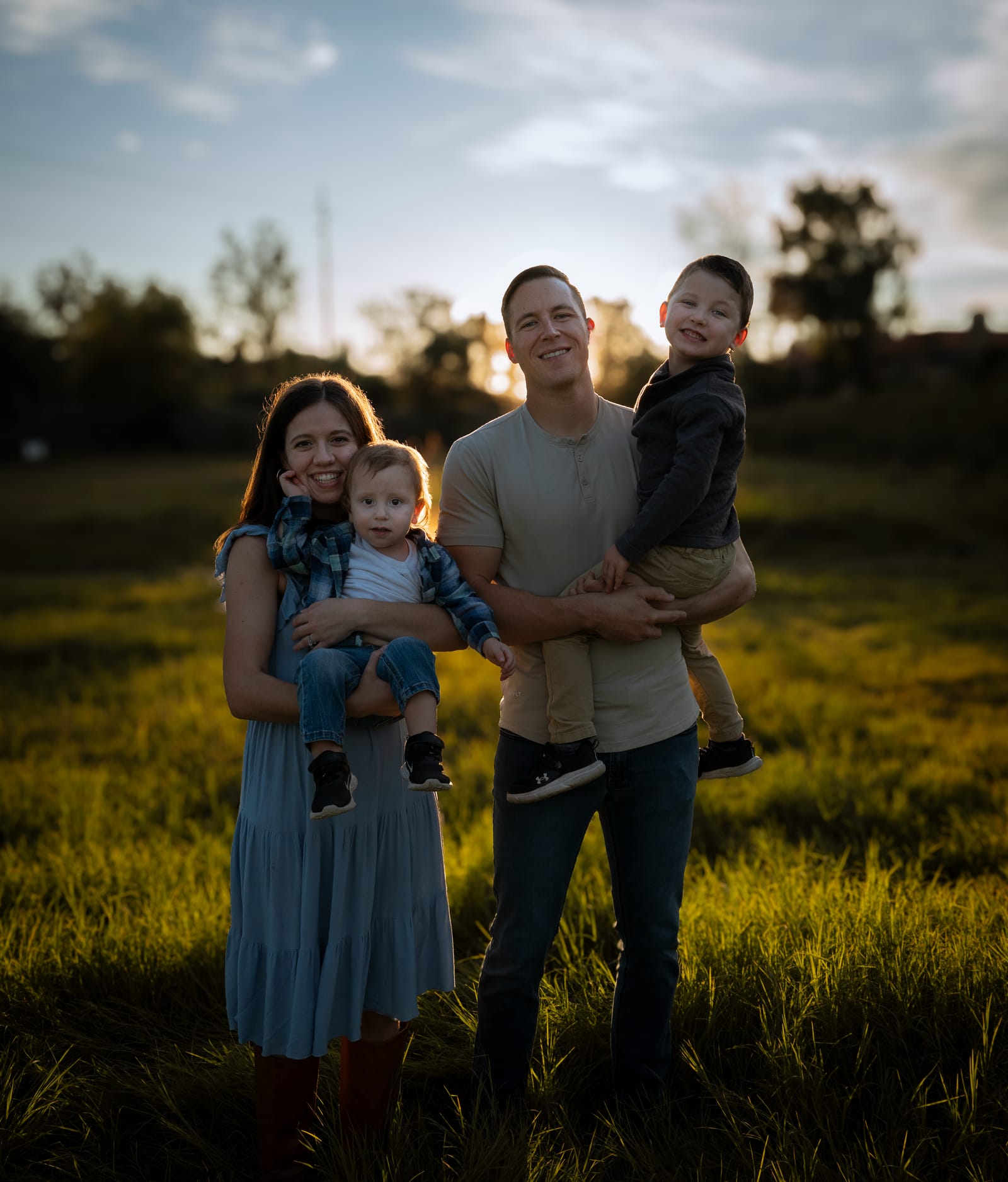 Family group portrait in a field at dusk, family photography in Phoenix, Arizona